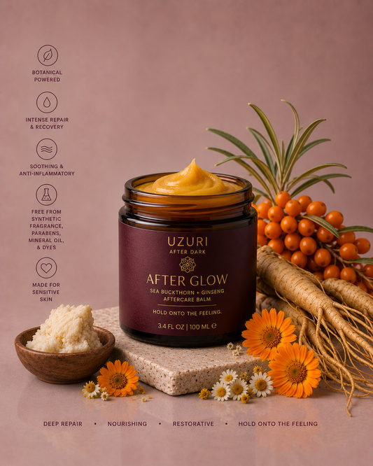 After Glow balm jar with sea buckthorn berries and flowers on a pink background